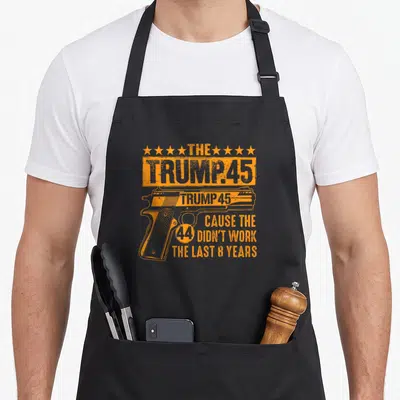 Brewery reindeer christmas apron - Orange handgun graphic with political text and distressed stars on black fabric — shown on a black cotton canvas apron against a white background