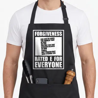 Christian e.a apron - FORGIVENESS RATED E FOR EVERYONE text design with biblical quote in white and black — shown on a black cotton canvas apron against a white background