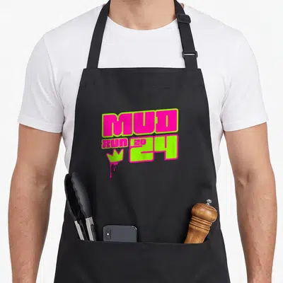 Muddy princess apron - Pink and lime green MUD RUN 2024 text with dripping crown graphic — shown on a black cotton canvas apron against a white background