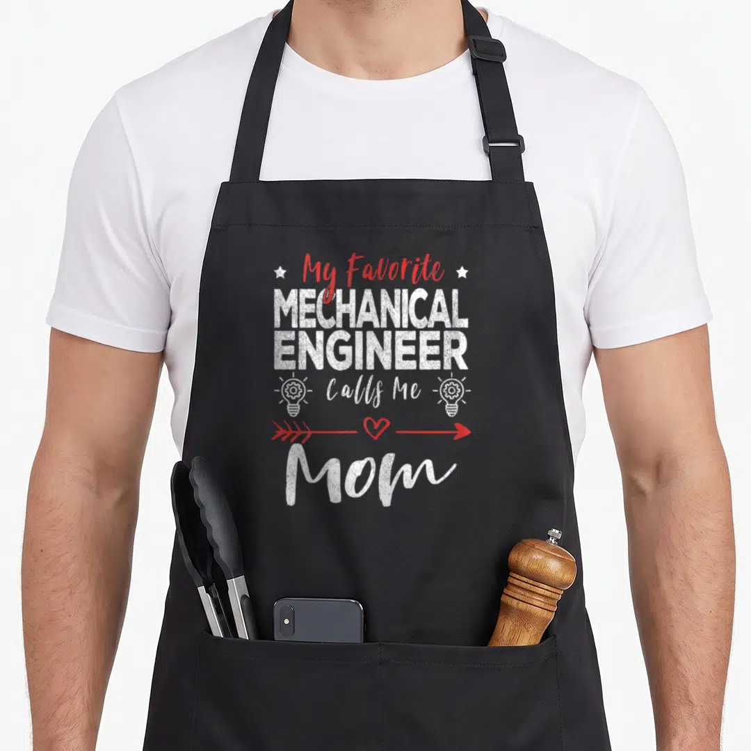 Cute call mechanical engineer apron - My Favorite MECHANICAL ENGINEER Calls Me Mom text with stars and gear lightbulbs — shown on a black cotton canvas apron against a white background