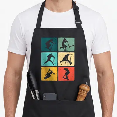 Rider scooter apron - Six colored squares with grey scooter rider silhouettes performing stunts in a grid layout — shown on a black cotton canvas apron against a white background