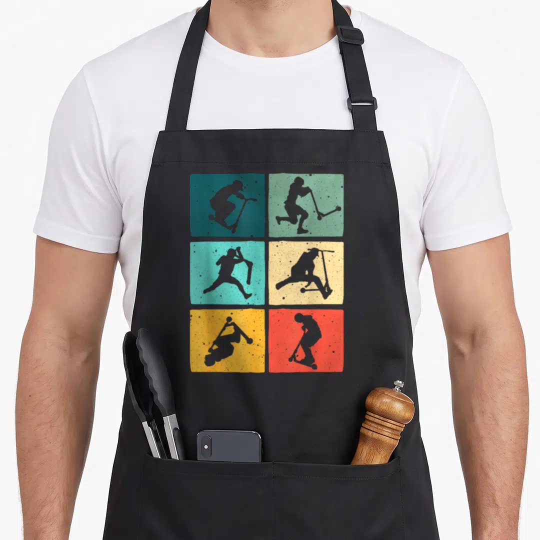 Rider scooter apron - Six colored squares with grey scooter rider silhouettes performing stunts in a grid layout — shown on a black cotton canvas apron against a white background