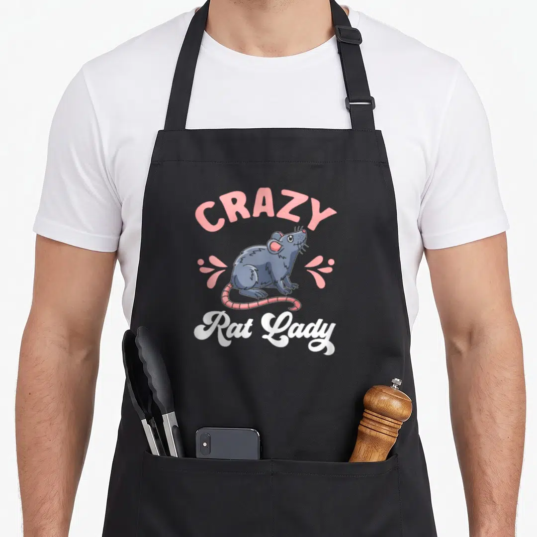 Retro rat animal apron - Cartoon blue-grey rat with pink droplets and text CRAZY Rat Lady in white script — shown on a black cotton canvas apron against a white background