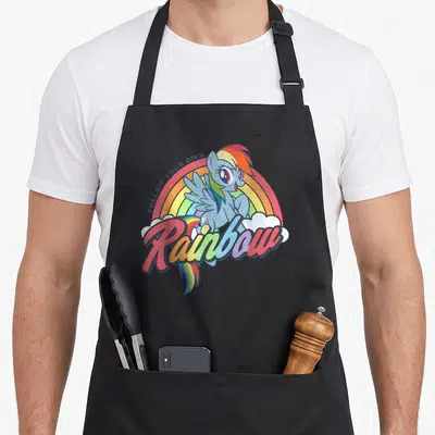 Dash rainbow apron - Blue pony with rainbow text and clouds on canvas apron — shown on a black cotton canvas apron against a white background