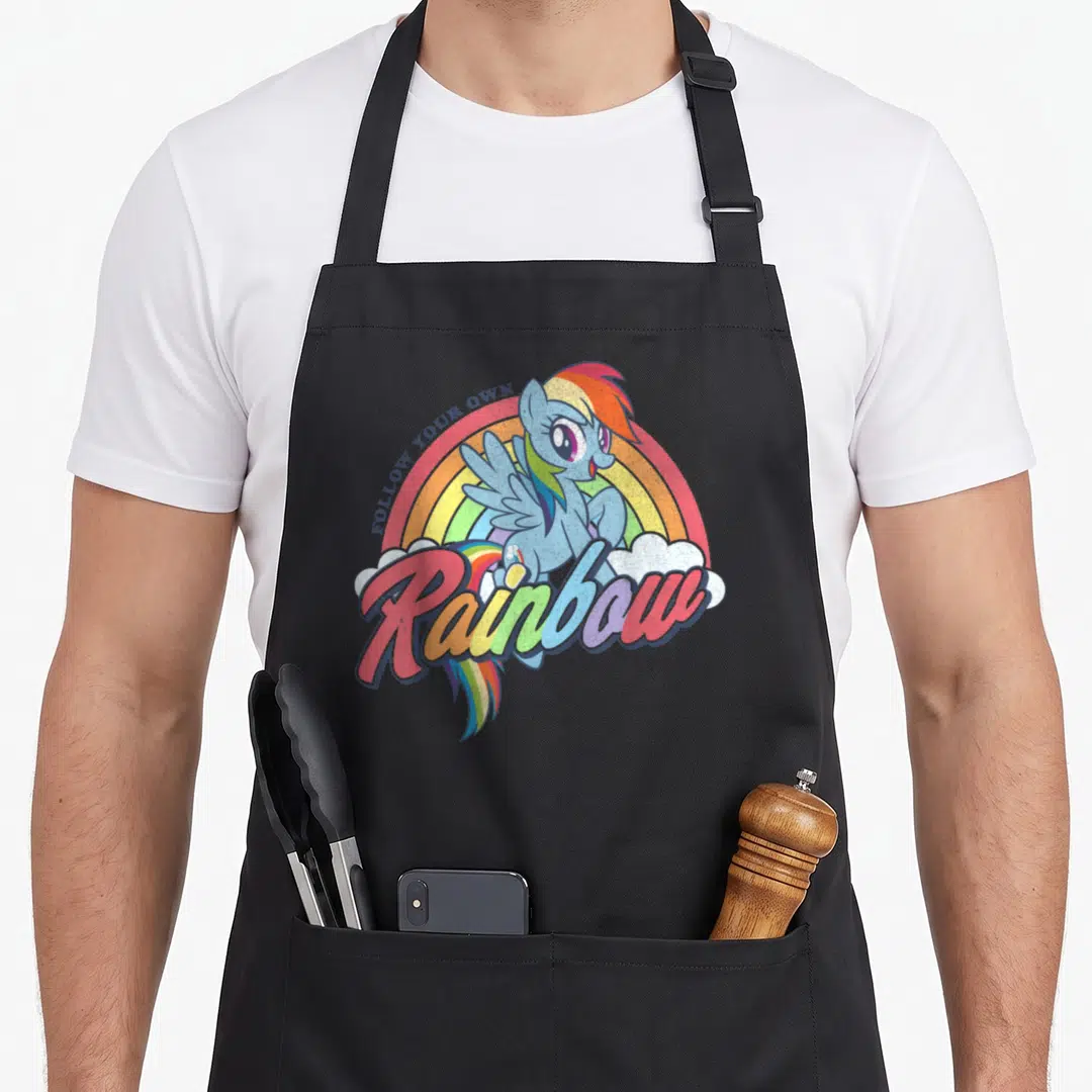 Dash rainbow apron - Blue pony with rainbow text and clouds on canvas apron — shown on a black cotton canvas apron against a white background