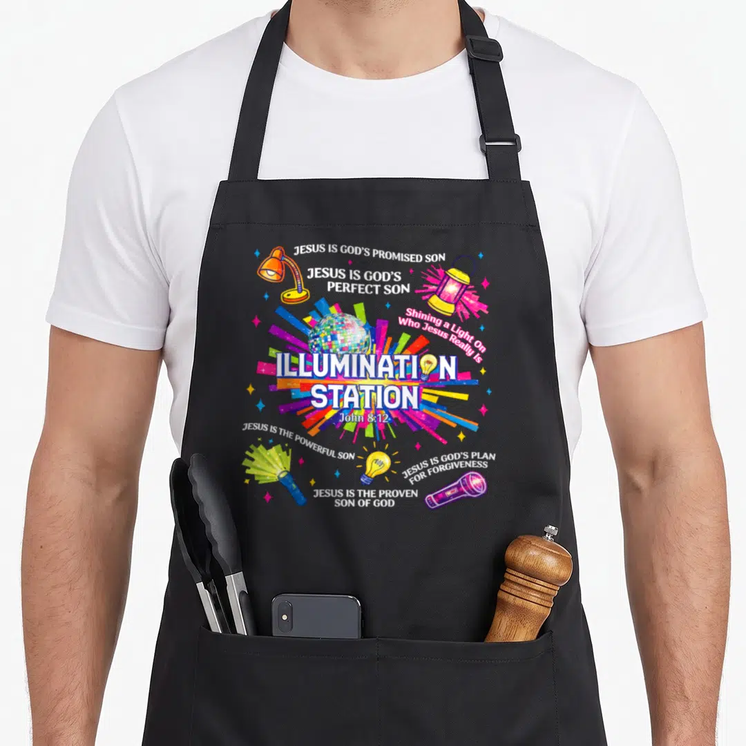 Vacation crew apron - Disco ball radiating multicolored light surrounded by lamps and religious text about Jesus — shown on a black cotton canvas apron against a white background