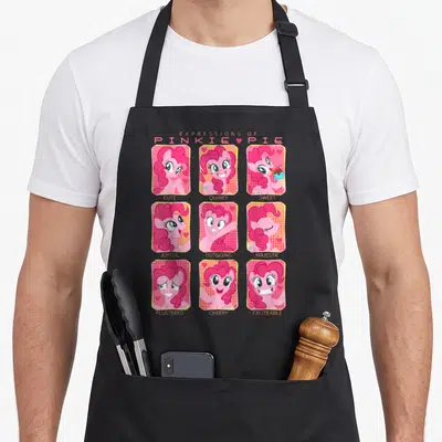 Expression magic apron - Pinkie Pie 3x3 portrait grid with labels Cute Quirky Sweet Joyful Outgoing Majestic Flustered — shown on a black cotton canvas apron against a white background