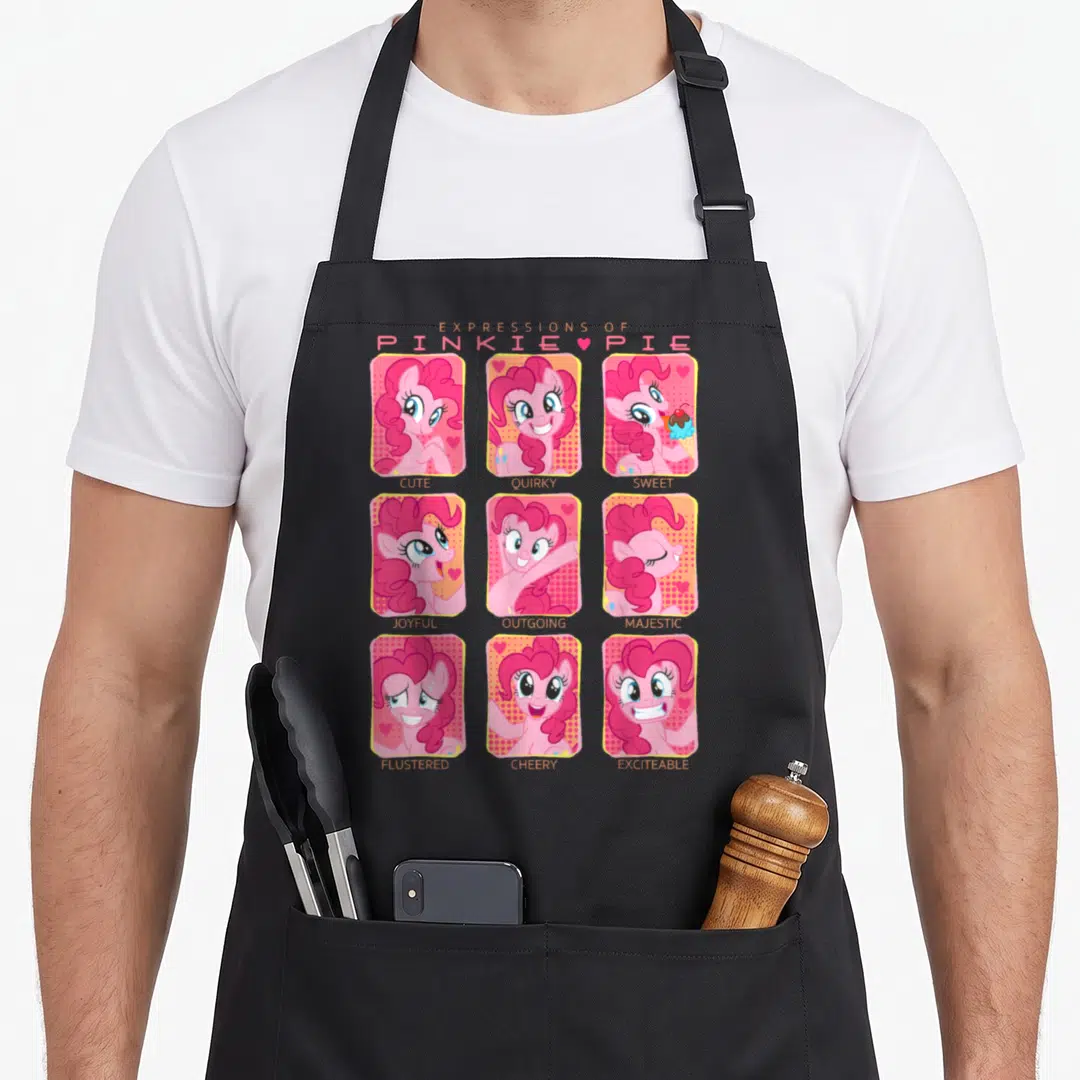 Expression magic apron - Pinkie Pie 3x3 portrait grid with labels Cute Quirky Sweet Joyful Outgoing Majestic Flustered — shown on a black cotton canvas apron against a white background