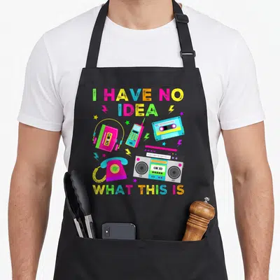 70s 80s chef outfit with apron - Retro boombox cassette phone lightning bolts and I Have No Idea What This Is text — shown on a black cotton canvas apron against a white background