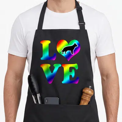 Rainbow german apron - Rainbow gradient LOVE text with heart containing black German Shepherd silhouette — shown on a black cotton canvas apron against a white background