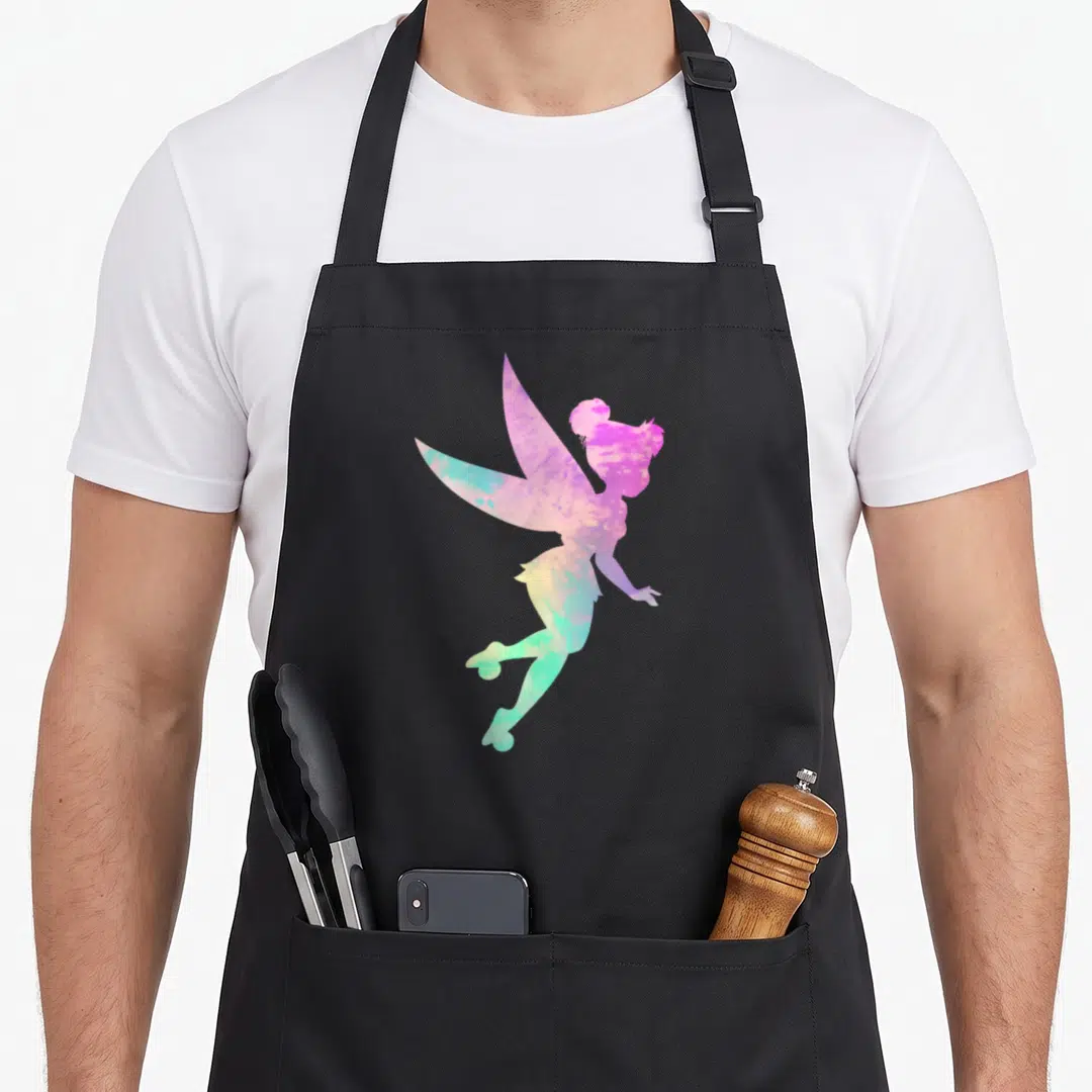 Peter tie apron - Fairy silhouette filled with pink purple blue green yellow watercolor gradient — shown on a black cotton canvas apron against a white background