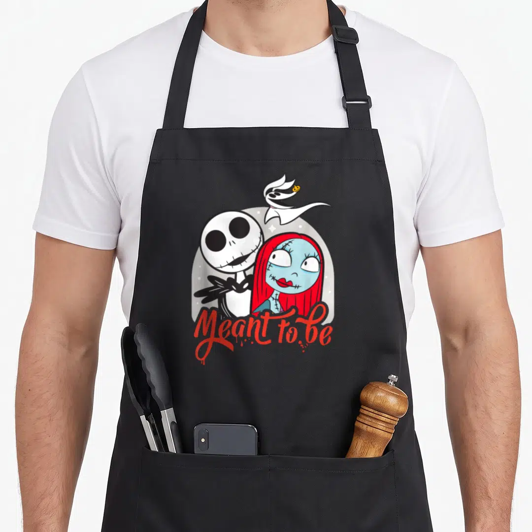Vintage jack christmas apron - Jack and Sally cartoon side-by-side with Zero and red Meant to be script — shown on a black cotton canvas apron against a white background