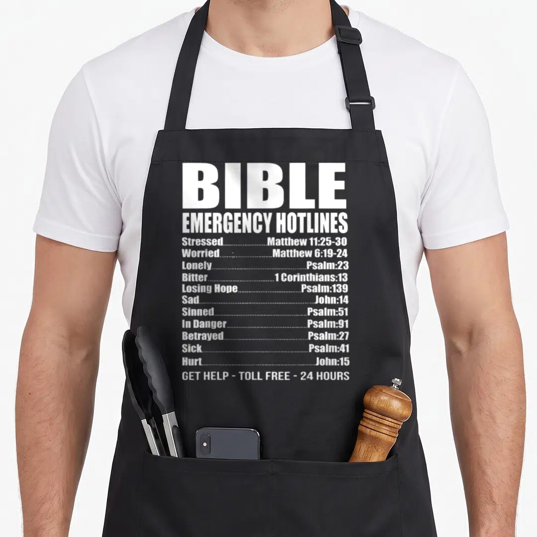 Number christian apron - White BIBLE EMERGENCY HOTLINES text listing emotions and scripture verses on black fabric — shown on a black cotton canvas apron against a white background