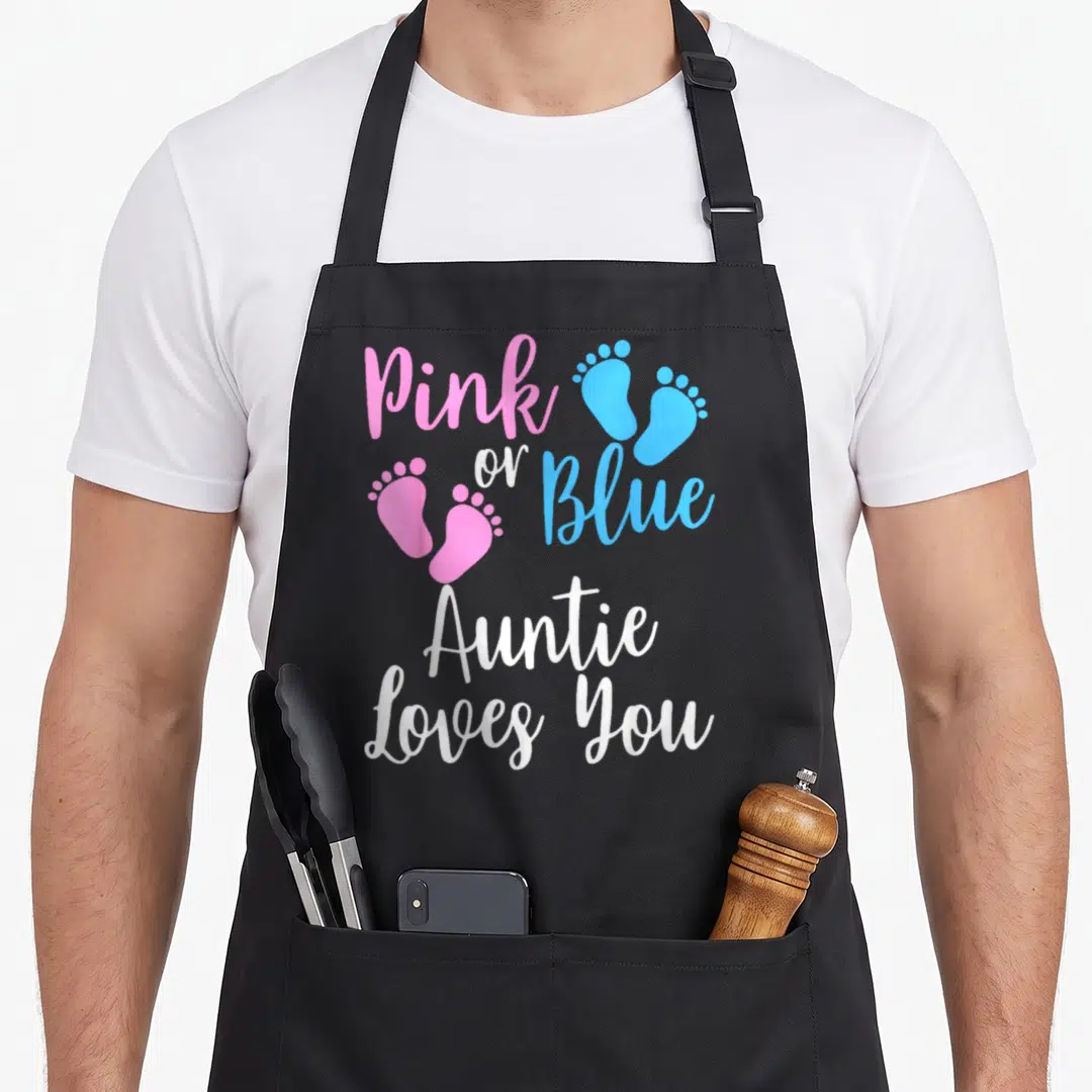 Aunt apron or apron - Pink and blue footprints with white Auntie Loves You text on black fabric — shown on a black cotton canvas apron against a white background