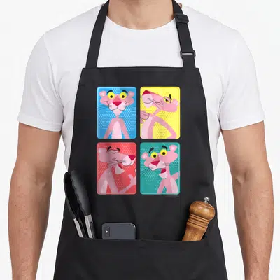 Portrait colorful apron - Four square panels of Pink Panther poses on blue, yellow, red, and teal halftone backgrounds — shown on a black cotton canvas apron against a white background