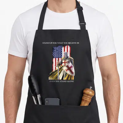 Lord jesus christian apron - Realistic knight holding sword and red cross shield in front of distressed flag with white — shown on a black cotton canvas apron against a white background
