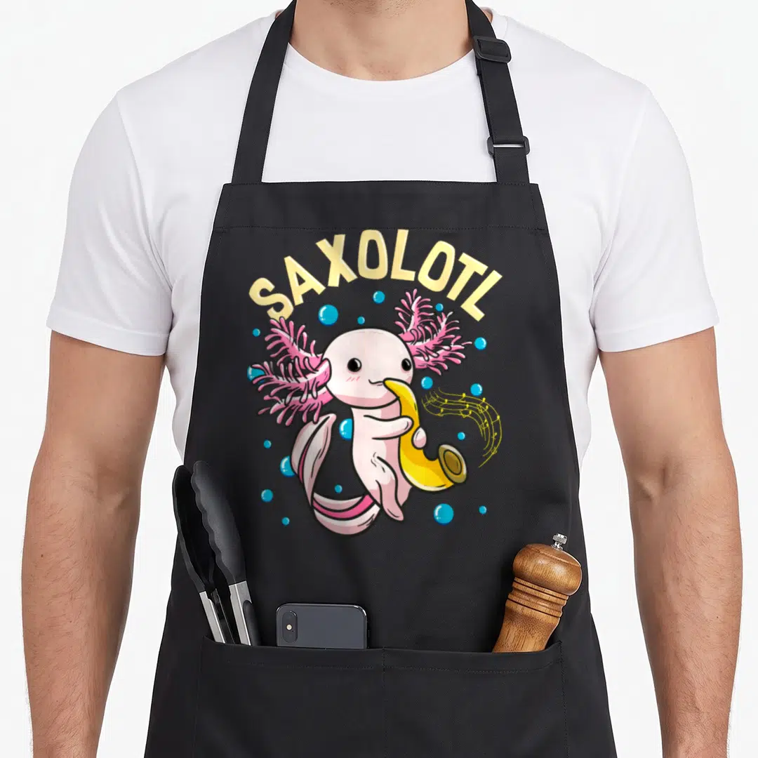 Saxolotl animal apron - Pink axolotl holding yellow saxophone with blue bubbles and arched SAXOLOTL text — shown on a black cotton canvas apron against a white background