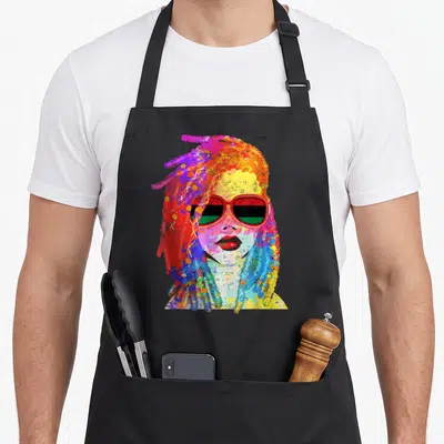 Queen hair apron - Watercolor portrait of woman with multicolored dreadlocks and red sunglasses reflecting red black — shown on a black cotton canvas apron against a white background