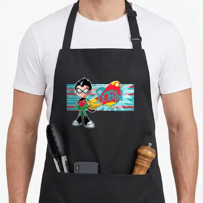 Robin character aprons - Cartoon hero standing beside a red bird silhouette with blue ROBIN text on striped background — shown on a black cotton canvas apron against a white background