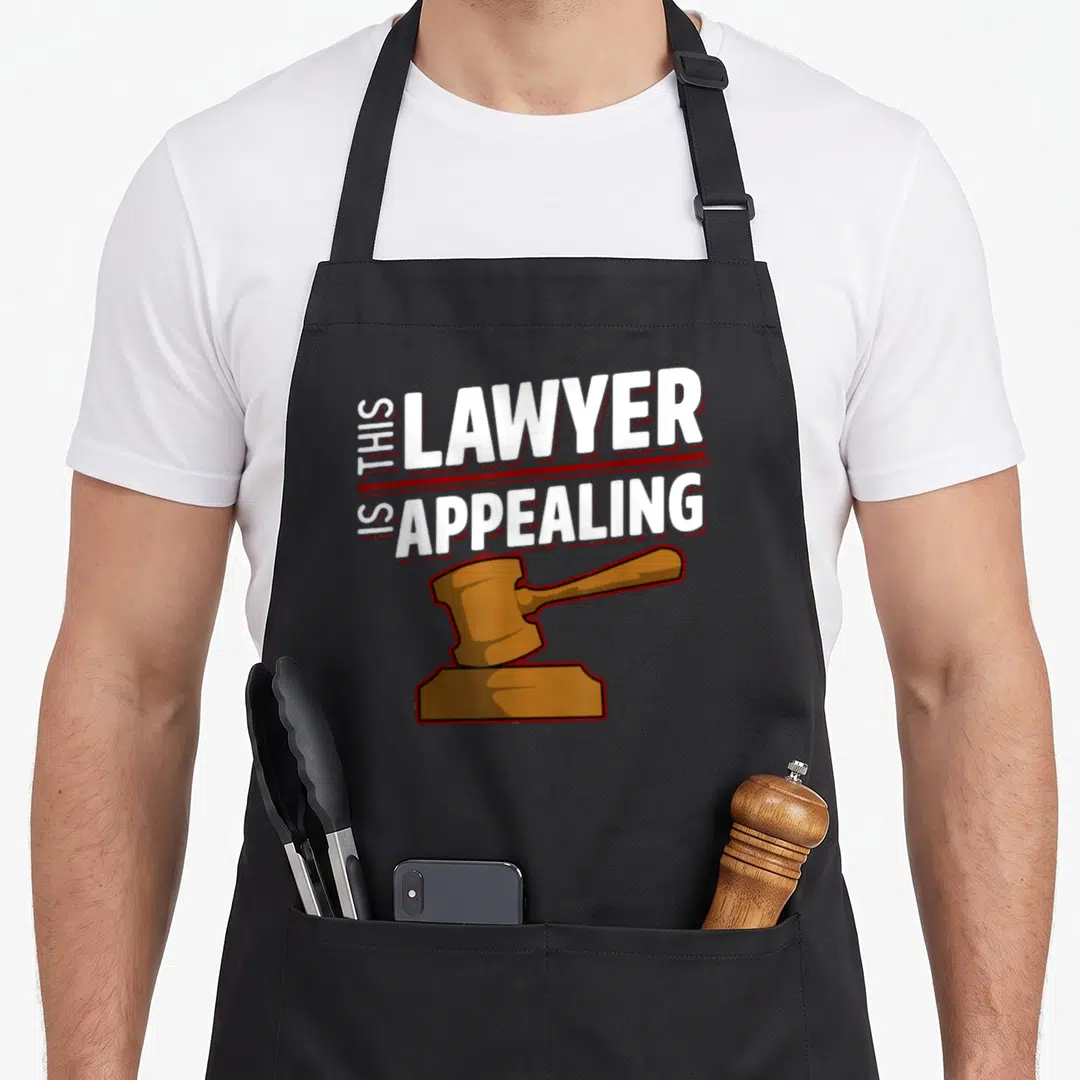 Appealing lawyer apron - This Lawyer Is Appealing text with brown cartoon gavel on black background — shown on a black cotton canvas apron against a white background