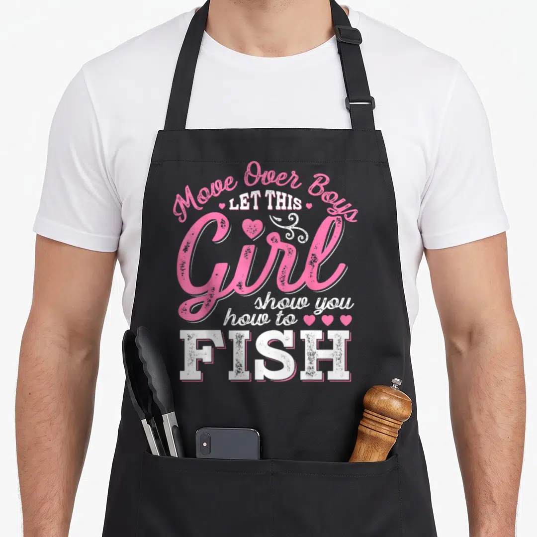 Move fish apron - Pink and white text reading Move Over Boys Let This Girl Show You How to FISH with hearts on black — shown on a black cotton canvas apron against a white background