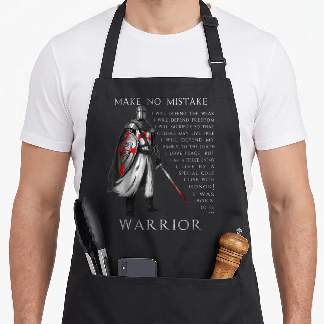 Mistake knight templar apron - Distressed knight holding sword next to text defending the weak and living with honor — shown on a black cotton canvas apron against a white background