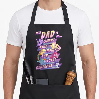 Father smart apron - Vertical stack of My Little Pony characters with virtues Smart Kind Honest Fun Loyal Generous — shown on a black cotton canvas apron against a white background