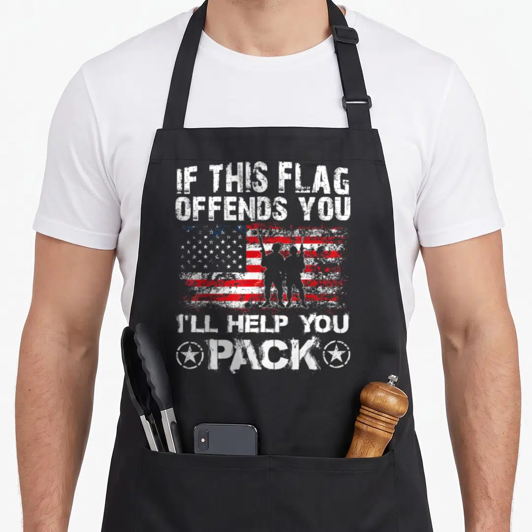 Flag veterans apron - Distressed USA flag with two soldier silhouettes and white text reading IF THIS FLAG OFFENDS YOU — shown on a black cotton canvas apron against a white background