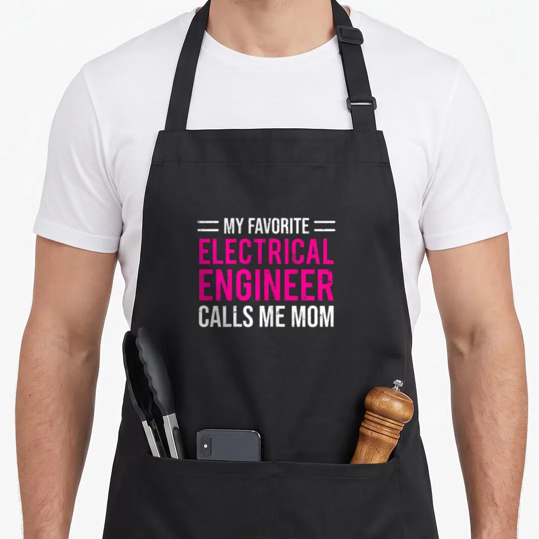 Electrical mother's apron - Pink and white text MY FAVORITE ELECTRICAL ENGINEER CALLS ME MOM with horizontal lines — shown on a black cotton canvas apron against a white background