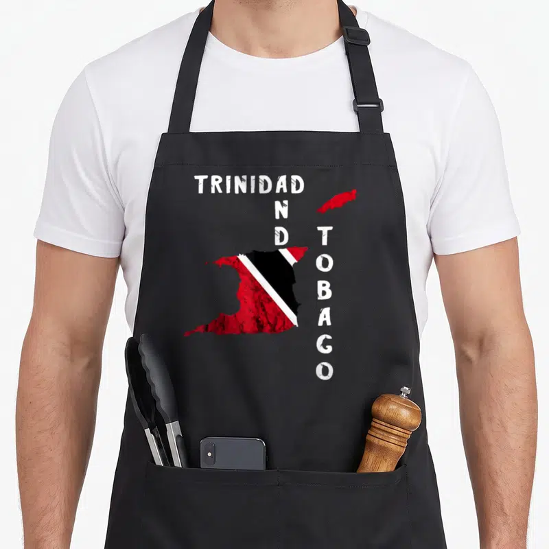 Trinidadian pride apron - Distressed map of Trinidad and Tobago filled with red black and white flag colors and split — shown on a black cotton canvas apron against a white background