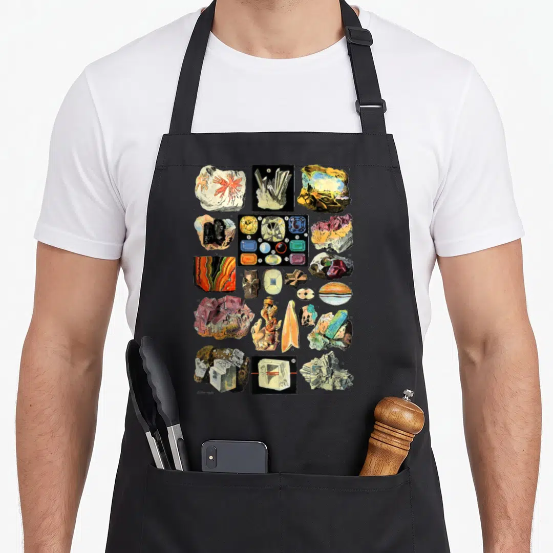 Mineral collecting apron - Grid of realistic mineral specimens, crystals, and a small statue in white blue yellow red — shown on a black cotton canvas apron against a white background