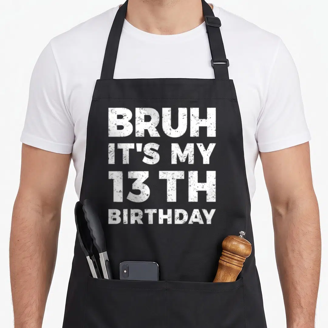 Bruh 13th birthday apron - White stacked text reading Bruh Its My 13 Th Birthday on grey background — shown on a black cotton canvas apron against a white background