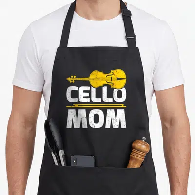 Funny music cello apron - Yellow cello and bow with distressed white CELLO MOM text on black — shown on a black cotton canvas apron against a white background