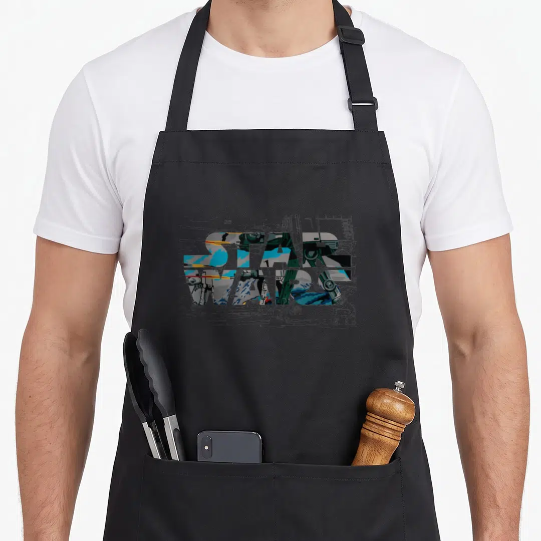 Battle walker apron - STAR text filled with AT-AT walker on grey blueprint background — shown on a black cotton canvas apron against a white background