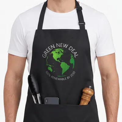 Aoc change apron - Green earth with Green New Deal and 100% Renewable By 2030 text — shown on a black cotton canvas apron against a white background