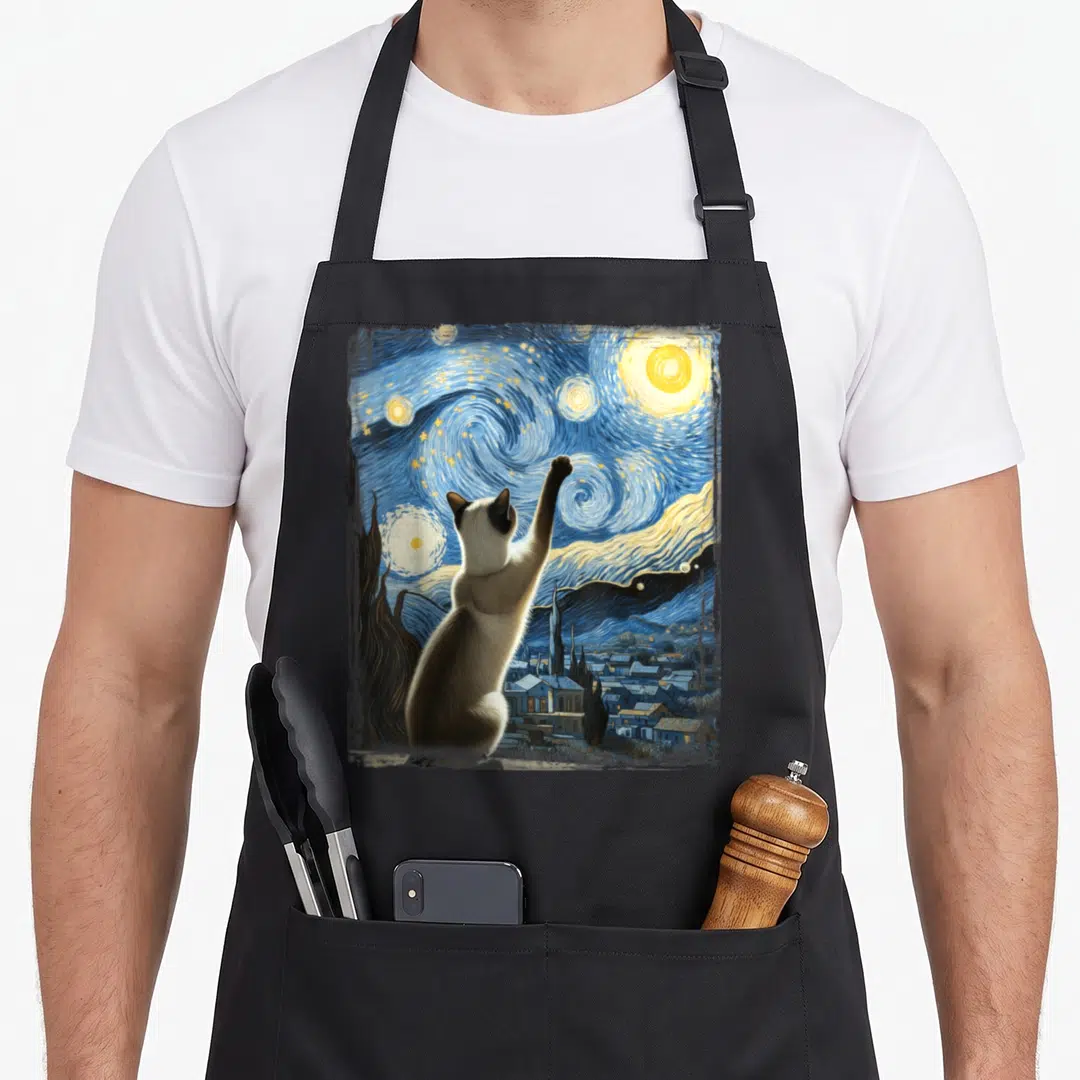 Gogh cute cat aprons - Cat seen from behind reaching up at swirling blue yellow cream starry night sky — shown on a black cotton canvas apron against a white background