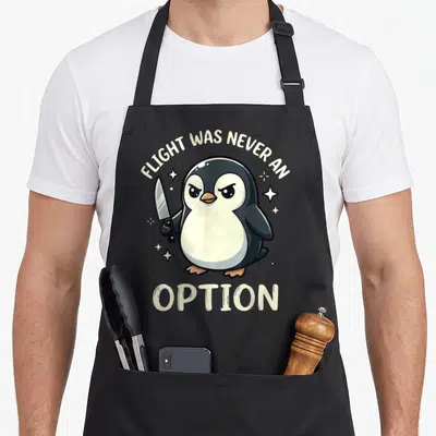 Funny flight never option apron - Cartoon penguin holding a knife with text Flight Was Never An Option — shown on a black cotton canvas apron against a white background