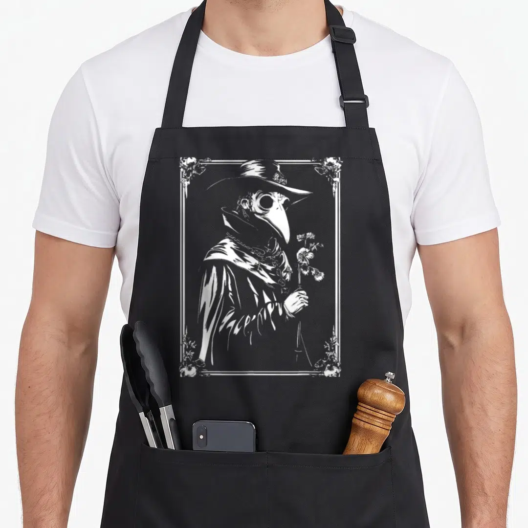Doctor gothic apron - White line-art plague doctor holding a flower inside a floral rectangular frame — shown on a black cotton canvas apron against a white background