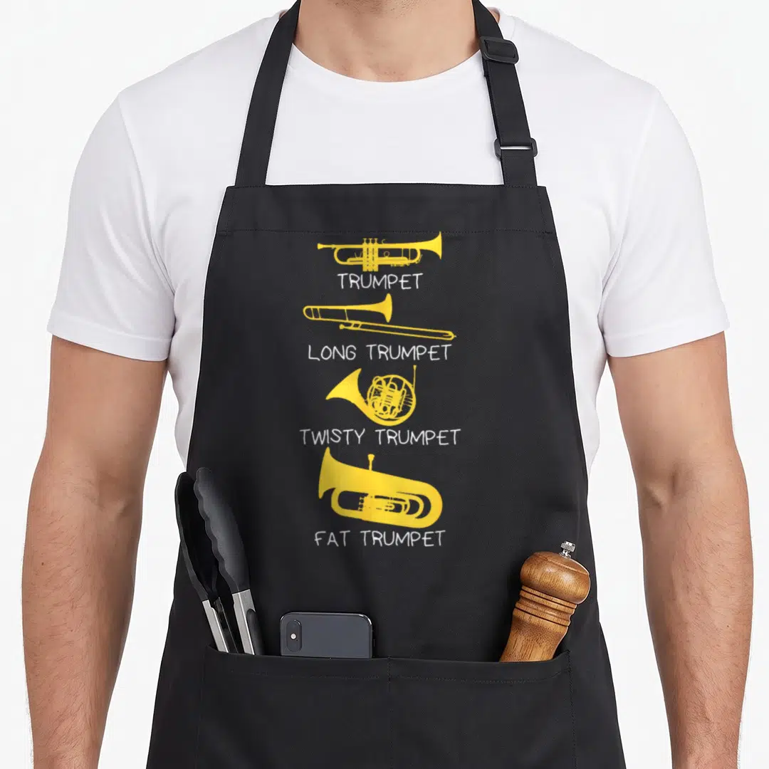 Marching trumpet apron - Four yellow brass instruments labeled trumpet long twisty and fat in white text — shown on a black cotton canvas apron against a white background
