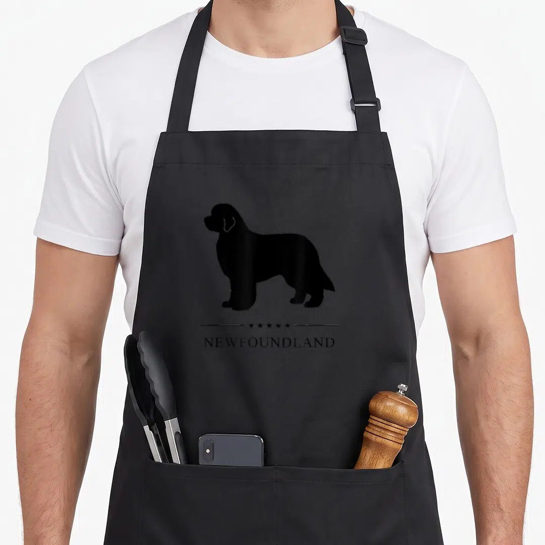 Silhouette newfoundland apron - Black dog silhouette above five stars and two lines with centered text — shown on a black cotton canvas apron against a white background