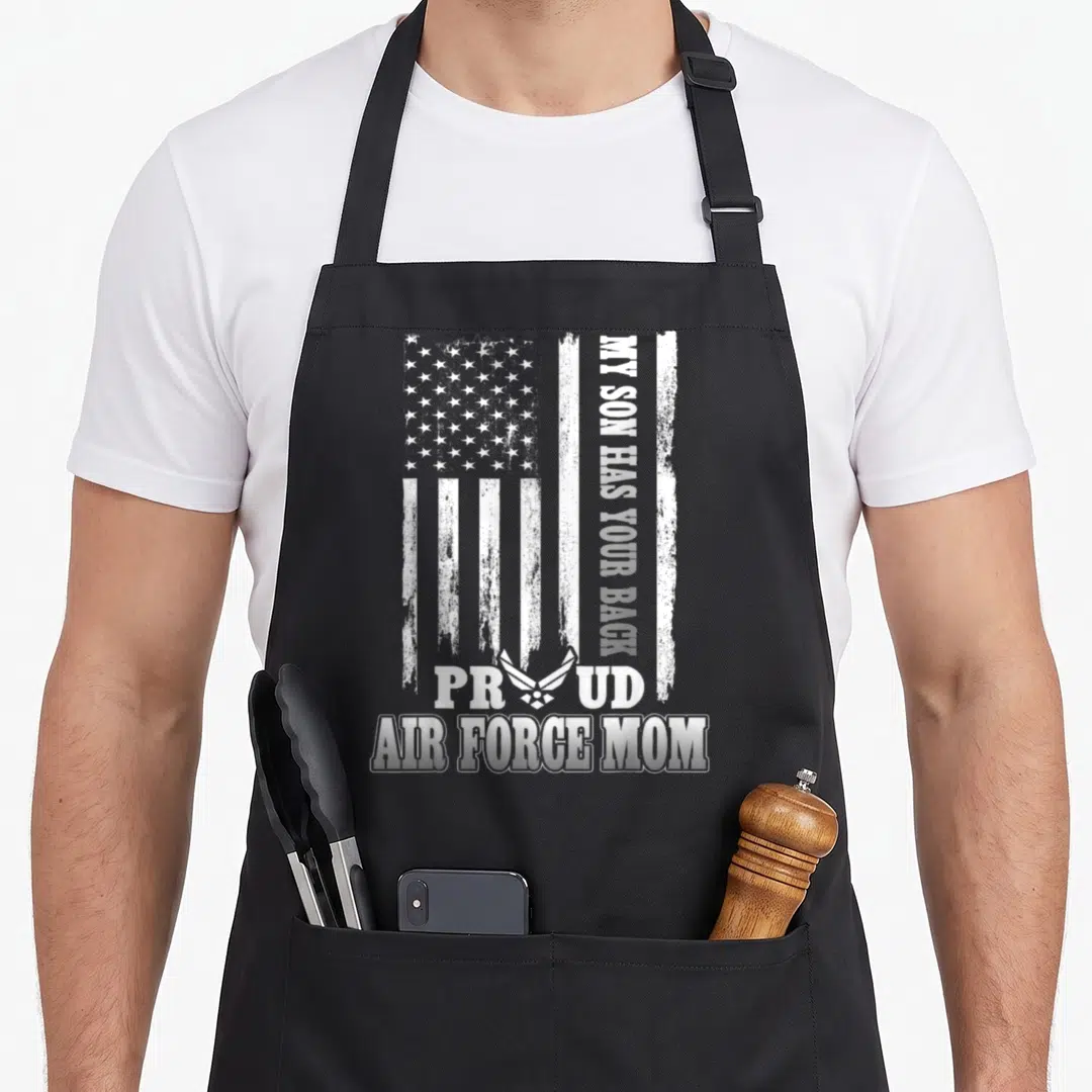 Force mom and son aprons - Distressed white USA flag with vertical MY SON HAS YOUR BACK text and Air Force symbol — shown on a black cotton canvas apron against a white background