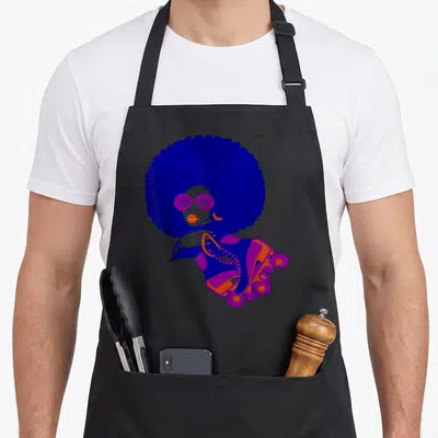 Afro roller 70s apron - Woman with blue afro and purple sunglasses holding orange and purple roller skate — shown on a black cotton canvas apron against a white background