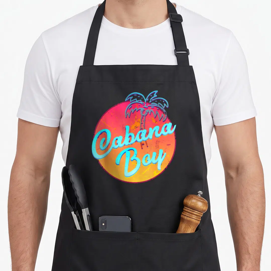 Cabana pool apron - Blue palm tree and Cabana Boy script over red yellow gradient circle — shown on a black cotton canvas apron against a white background