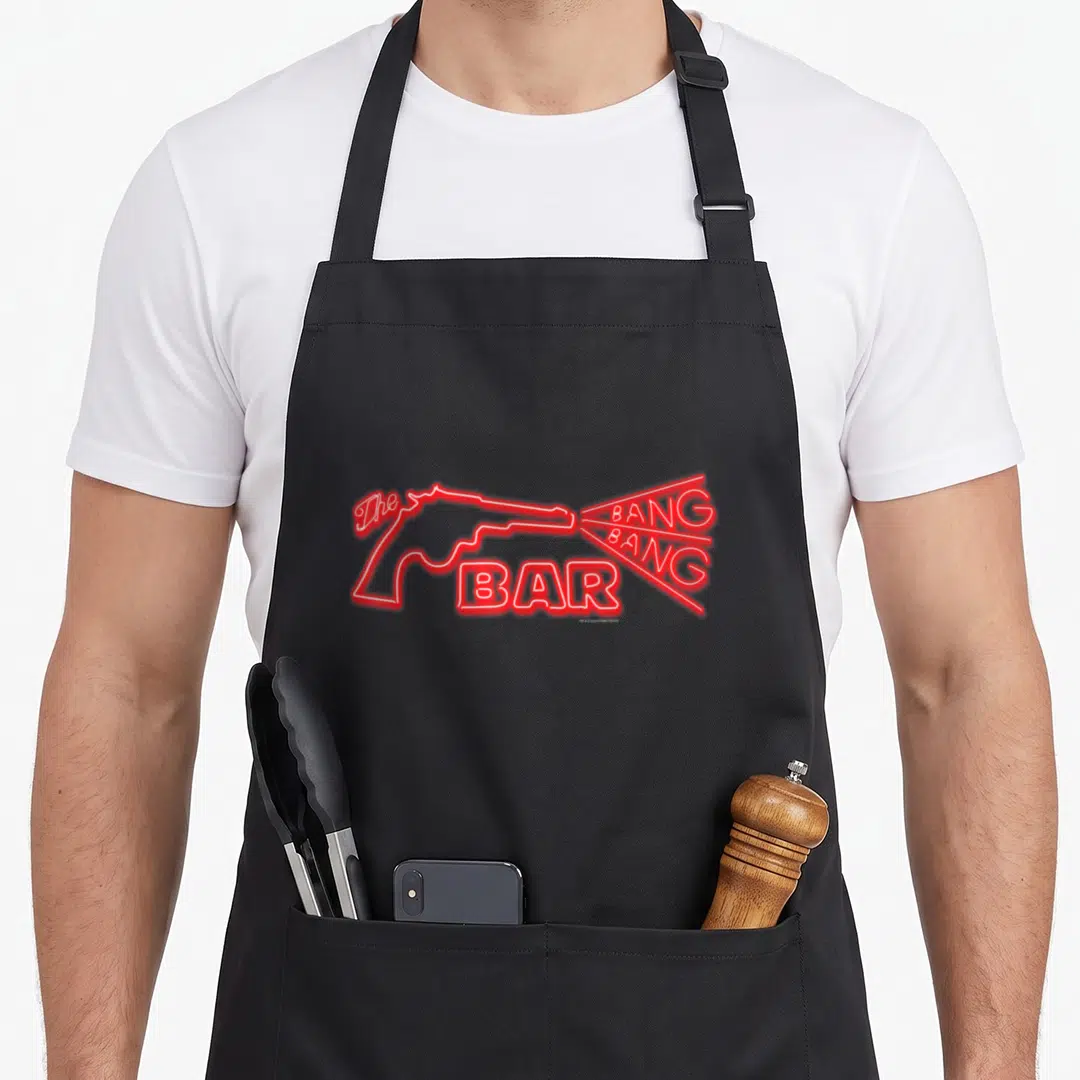 Bang twin peaks apron - Red neon outline of a gun with The Bang Bang Bar text inside muzzle flash — shown on a black cotton canvas apron against a white background