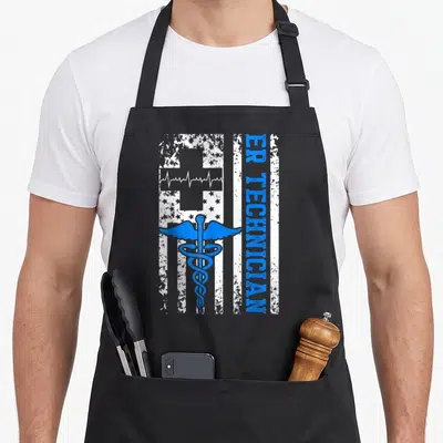 Technician room apron - Blue caduceus over distressed white flag with vertical ER TECHNICIAN text — shown on a black cotton canvas apron against a white background