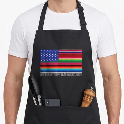 Mayo american flag apron - Rectangular flag with blue star field, multicolored stripes, and white fringe on canvas — shown on a black cotton canvas apron against a white background