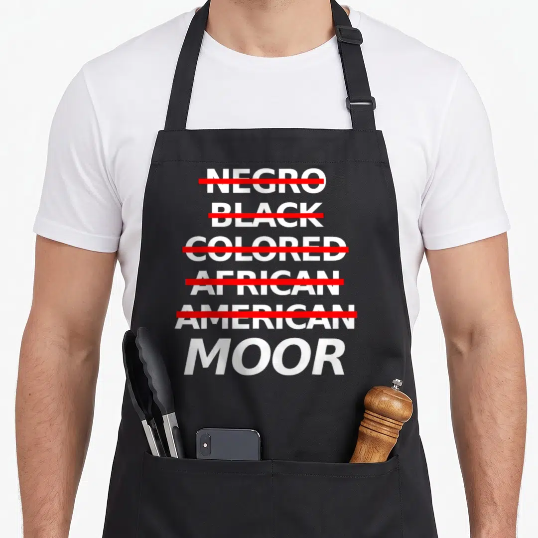 Moorish moorhead apron - Stacked white words crossed out in red leaving only Moor visible — shown on a black cotton canvas apron against a white background