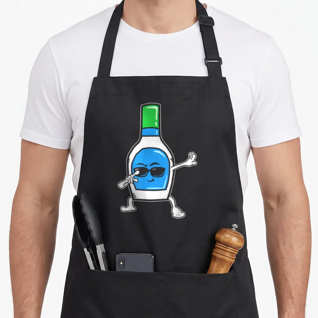Ranch dabbing boys apron - Cartoon nail polish bottle with sunglasses dabbing in blue white green and black — shown on a black cotton canvas apron against a white background