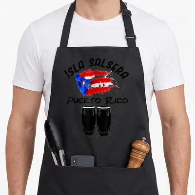 Salsa puerto pride apron - Isla Salsera text over watercolor Puerto Rico flag with two black conga drums and grey — shown on a black cotton canvas apron against a white background