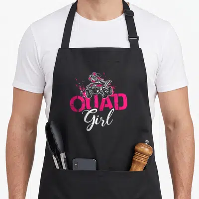 Quad wheeler girl apron - Distressed pink QUAD and white Girl text under a quad bike rider with dirt splashes — shown on a black cotton canvas apron against a white background